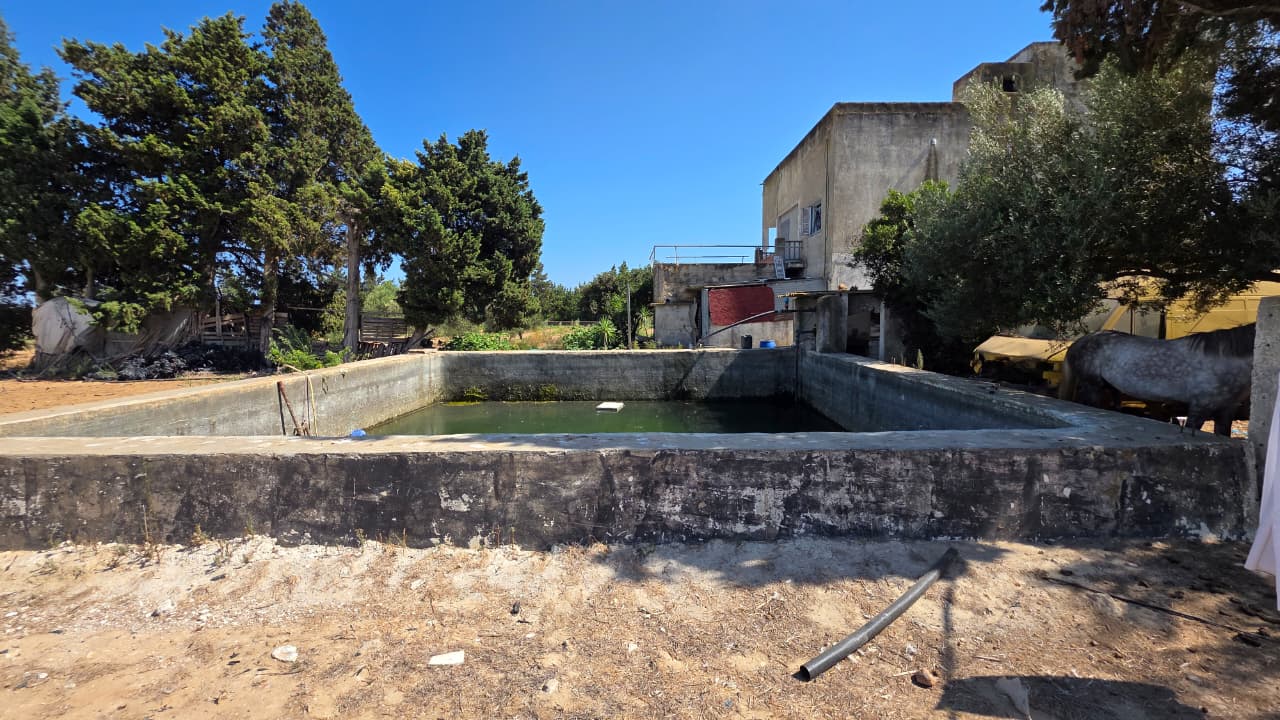 DOMAINE DE 10840 m² AVEC VILLA ET DÉPÔT à TAZARKA